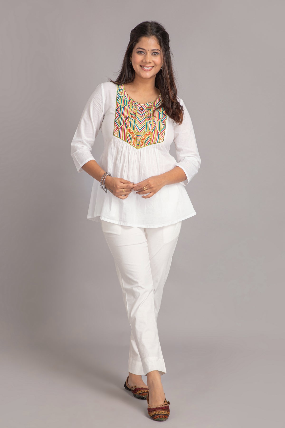 FLARED SHORT TOP WITH MULTICOLOR GEOMETRIC EMBROIDERY AT YOKE