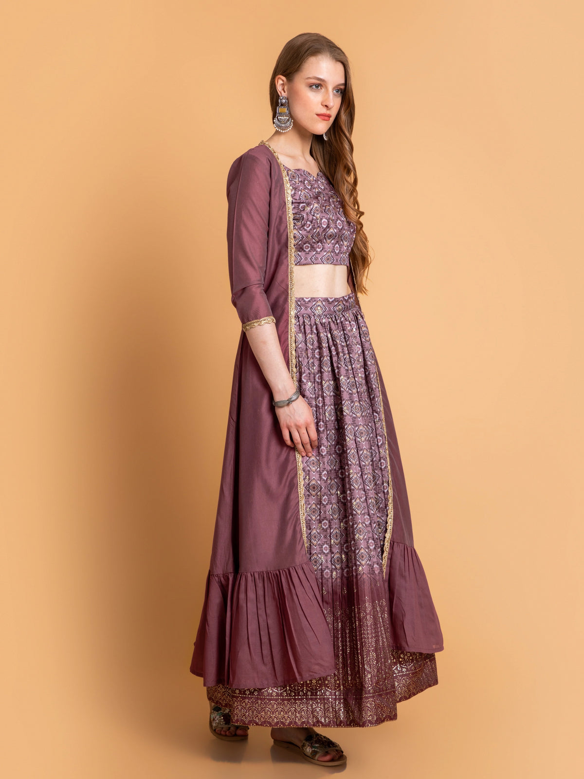 SUTI WOMEN CHANDERI BASE 3PC FUSION SKIRT SET PAIRED WITH LONG SHRUG EMBELIISHED WITH LACE DETAILS.