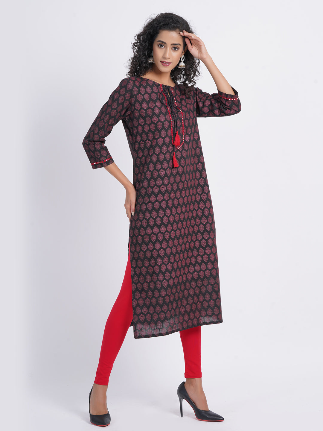 CASUAL WORK WEAR IN OUR CONTRAST PRINTED WITH MIRROR WORK EMBROIDERY STRAIGHT KURTI DETAILED WITH DORI TESSEL.